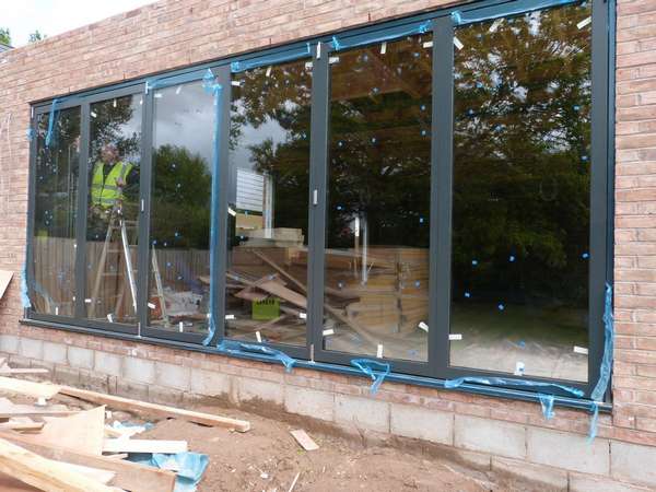 AKC Construction - New Development - Eyebrook Bowden Cheshire : Installtion of Centor C1t Bi Folding doors . Flush floor walk through Triple Glazed U value .6
